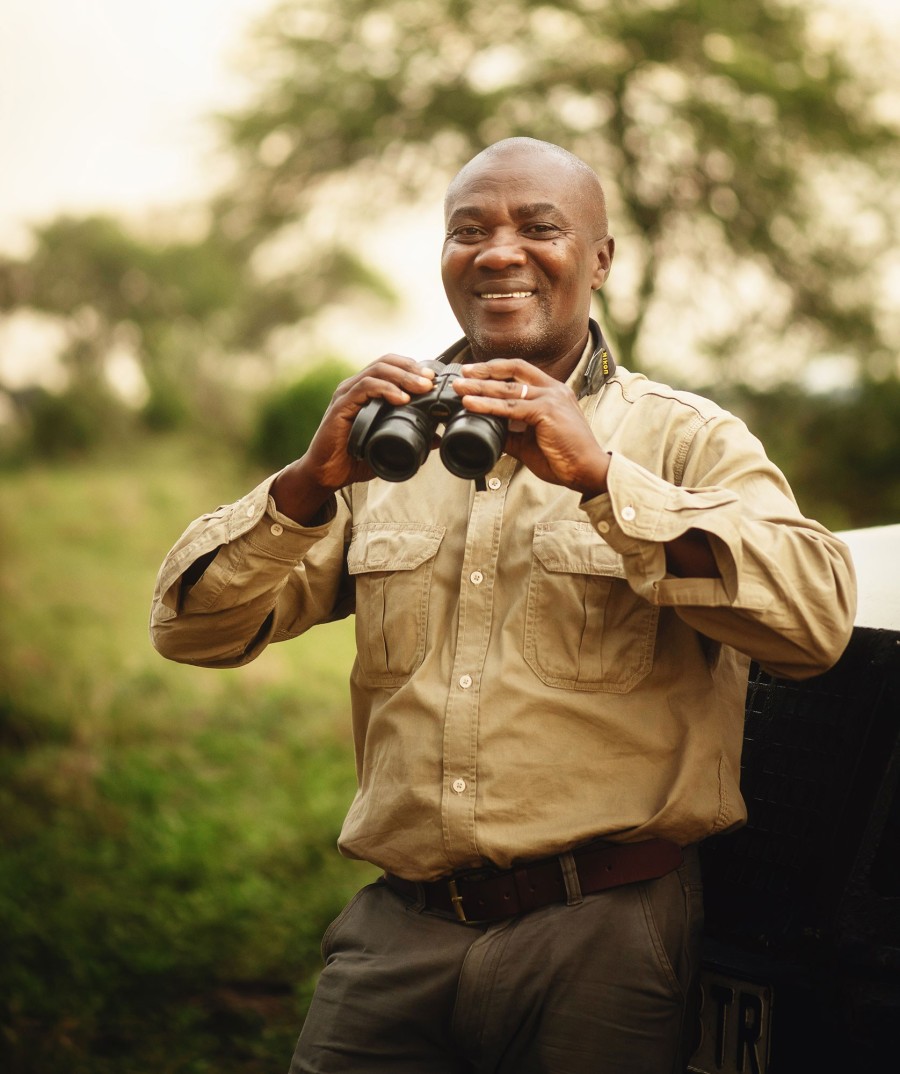 Amos Noah, safari guide at Nomad Serengeti Safari Camp, smiling portrait