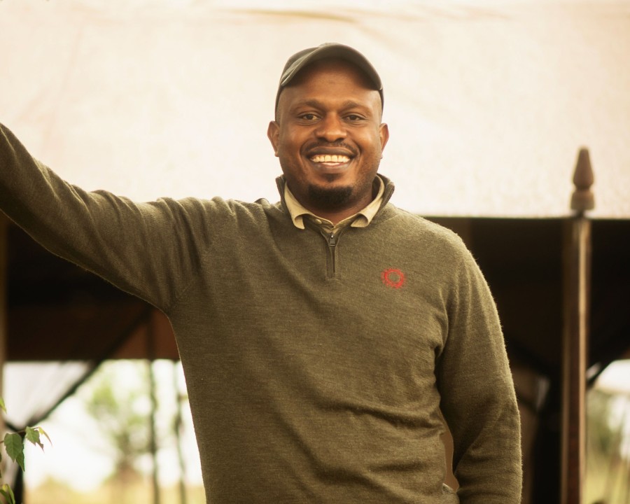 Kanaeli Nanyaro, nomad camp manager at serengeti safari camp, smiling portrait